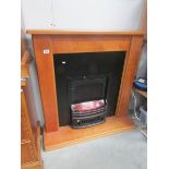 A fire surround with inset fire,