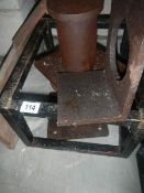 Heavy fabricated metal machinery stands and holed bracket.