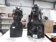 2 African carved busts.