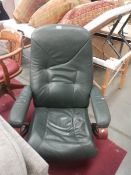 A green leather 'Stressless' armchair (seat needs attention).