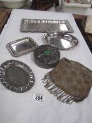 4 small silver plated trays, a pewter box and a mesh bag.