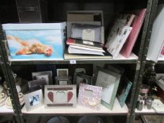 2 shelves of photograph albums, wedding planner book, photograph frames, storage box etc.