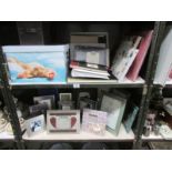 2 shelves of photograph albums, wedding planner book, photograph frames, storage box etc.