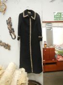 An Alexon young set by Alanah Tandy full length black coat with embroidered edges.