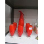 A vintage vibrant orange lemonade jug and 5 glasses.