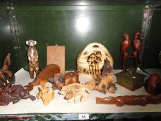 A collection of wooden animal figures and fungi