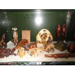 A collection of wooden animal figures and fungi