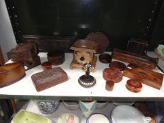 A collection of carved wooden items, including incense burner, trinket pots, trays etc.