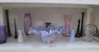 A shelf of glass ware including studio.