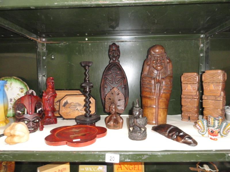 An assortment of 15 wooden ornamental items including figures, trays, masks etc.
