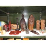 An assortment of 15 wooden ornamental items including figures, trays, masks etc.
