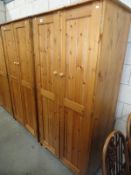 A double pine wardrobe.