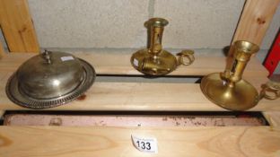 A small early silver plate tray, a lid and 2 brass chamber candlesticks.