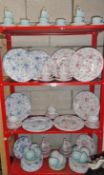 4 shelves of dinner and tea ware, various patterns.