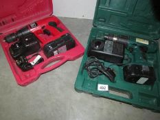 2 cased electric drills.