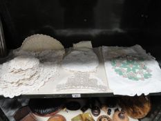 An assortment of linen and table crochet ware