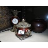 An ornament quartz movement clock with matching trinket pot and another trinket pot