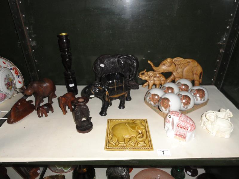 A collection of elephant themed ornaments including figures