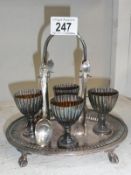 Silver plate 4-person egg cup stand.