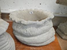 A large sack planter.