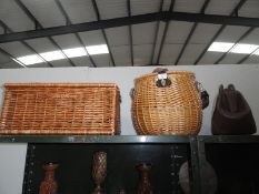 A wicker picnic basket,