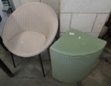 A lloyd loom chair and a linen basket.