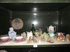 A collection of oriental themed items including figures, teaware etc.