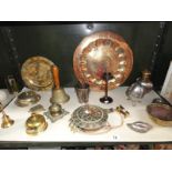 An assortment of metal ware including bells, inkwell, plaques etc.