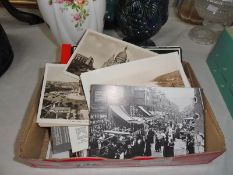 A box of assorted postcards.