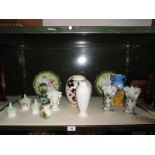 A shelf of assorted ceramic ware consisting of vases, plates, trinket pots etc.