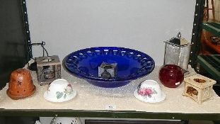 A blue art glass bowl and candle holders