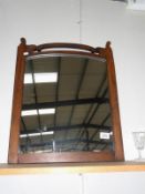 A wood framed mirror.