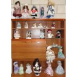 A quantity of porcelain dolls etc.