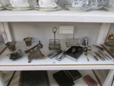 A mixed lot of silver plate including egg cup set. toast rack etc.