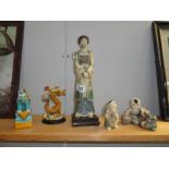A quantity of chinese figures, including dragon and foo dog.