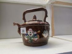 A ceramic barge teapot.
