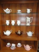 A quantity of teapots, jugs etc.