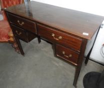 A darkwood stained desk.