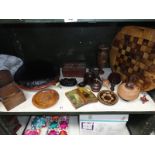 An assortment of wooden ware including chess board, trinket pots, upholstered foot stool etc.