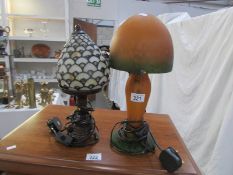 A Tiffany style table lamp and one other.