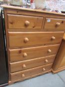 A 2 over 4 pine chest of drawers.