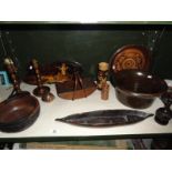 An assortment of 12 wooden ornamental items including trays, candlesticks, bowls etc.