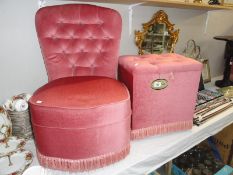 A pink plush bedroom chair and storage box.