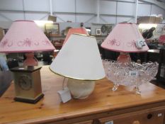 4 table lamps, a clock and a glass bowl.