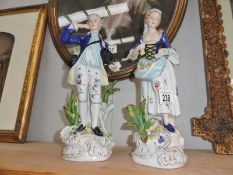 A pair of porcelain figurines.