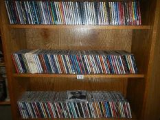 3 shelves of assorted CDs including swing, big band, musical, pop, folk, country, classical etc.