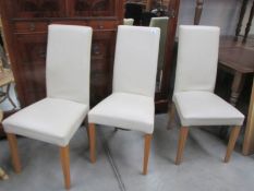 3 modern dining chairs.