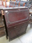 A mahogany effect bureau.