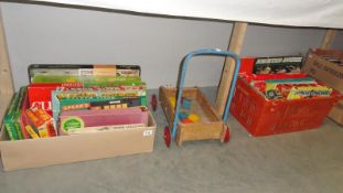 A quantity of board games (some vintage) and a vintage baby walker etc.