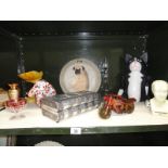 A shelf of assorted items including Fowler Phrenology bust,
